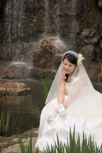 Jiajia in a wedding dress in the park