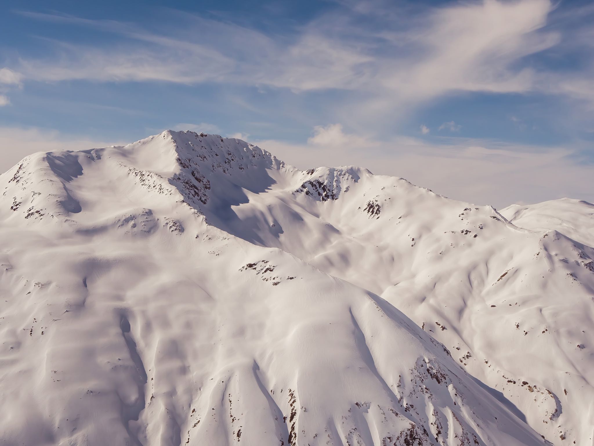 Enjoying the majestic view of the snow-capped peaks and stunning glaciers as we hike through the Alpine region of the mountain range.