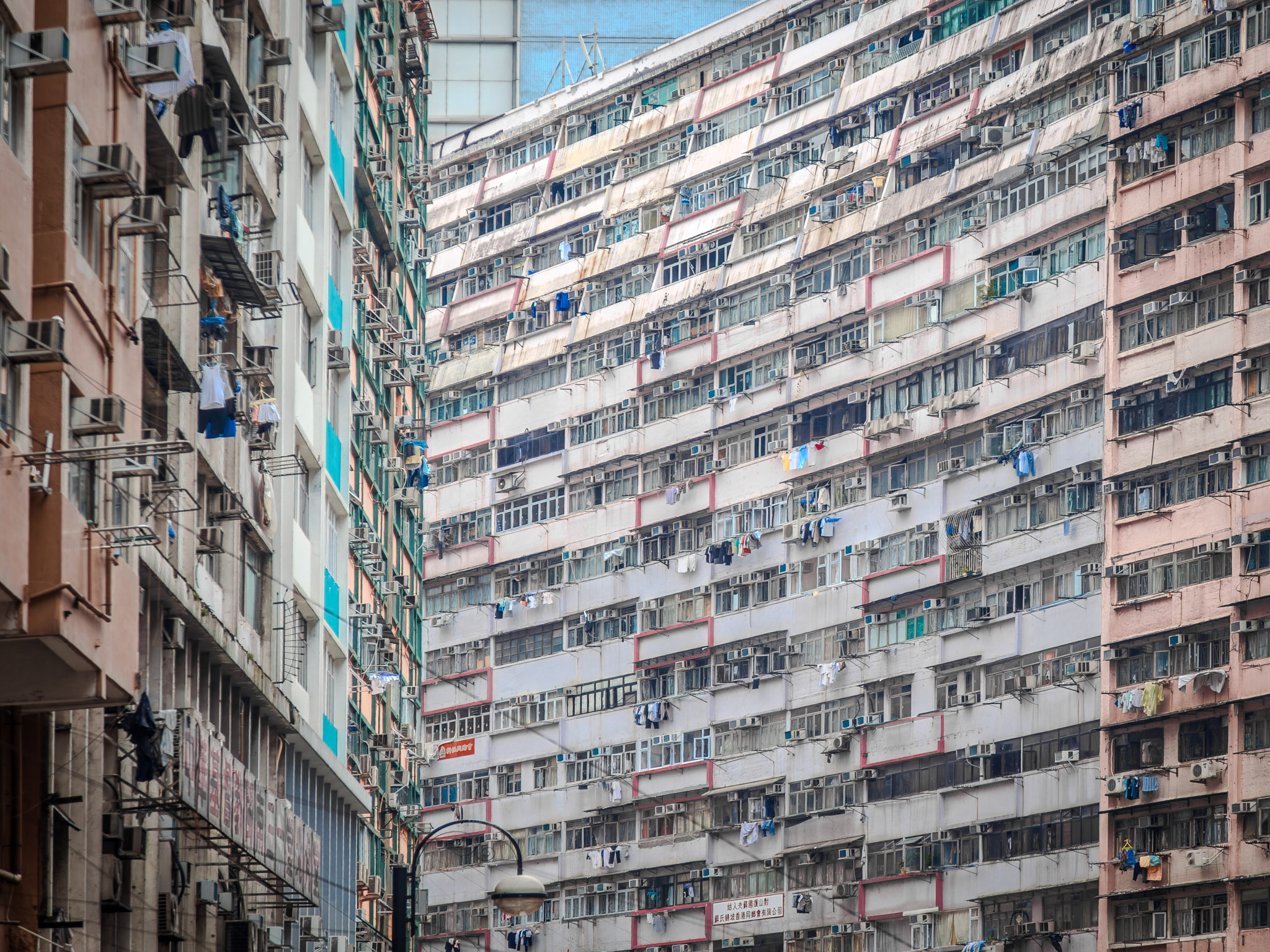 City of Glass: A modern skyscraper district in Hong Kong showcases an impressive array of towering glass buildings and apartments, reflecting the city's contemporary urban style and its fast-paced business and real estate industry.
