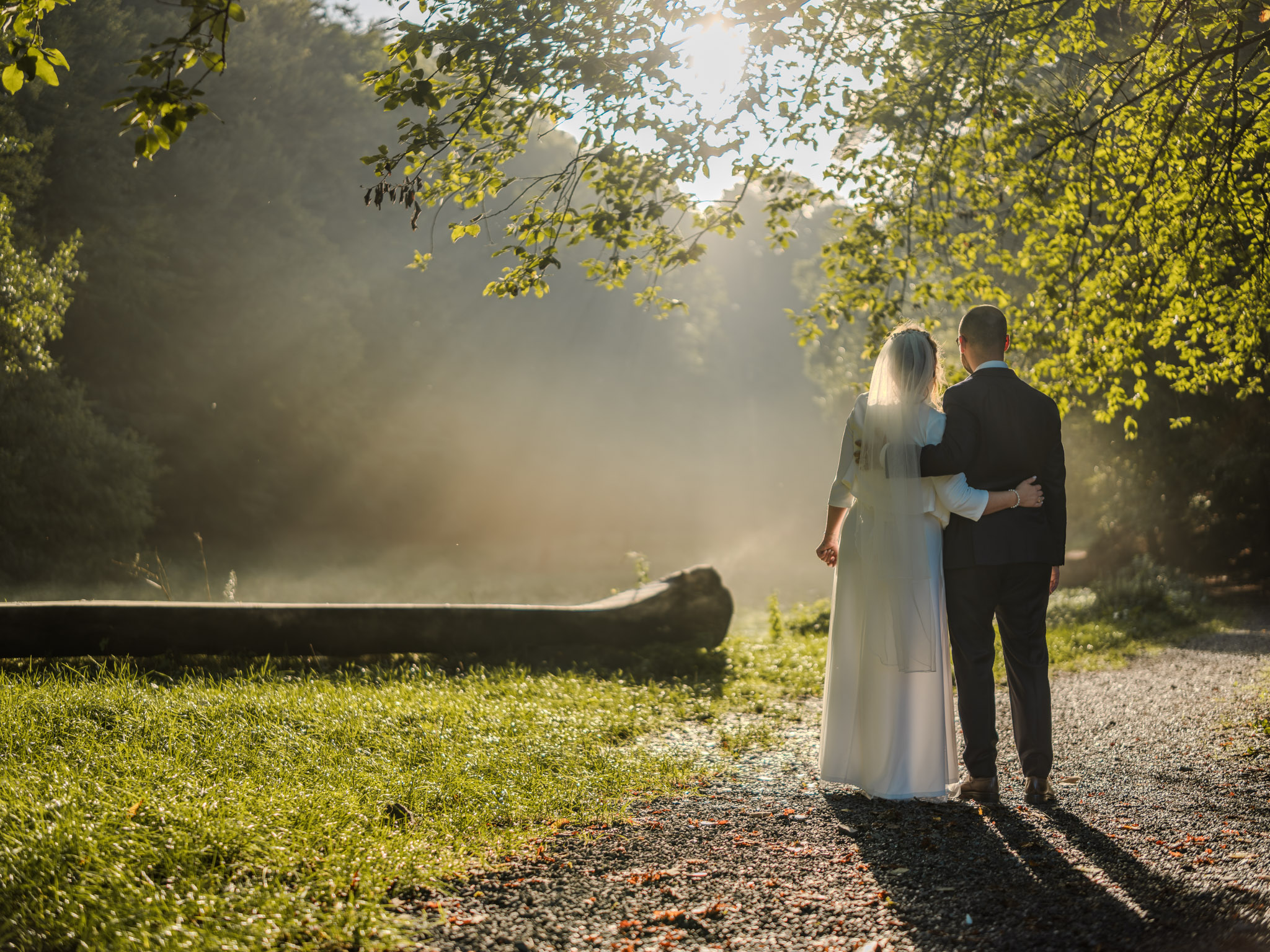 Under the summer sky in Cologne, Thomas and Nadine embrace their love, surrounded by the sweet fragrance of the grass and the joy of being married. As they smile at each other, their hearts beat as one in this idyllic outdoor setting, celebrating the beginning of their journey together as husband and wife.