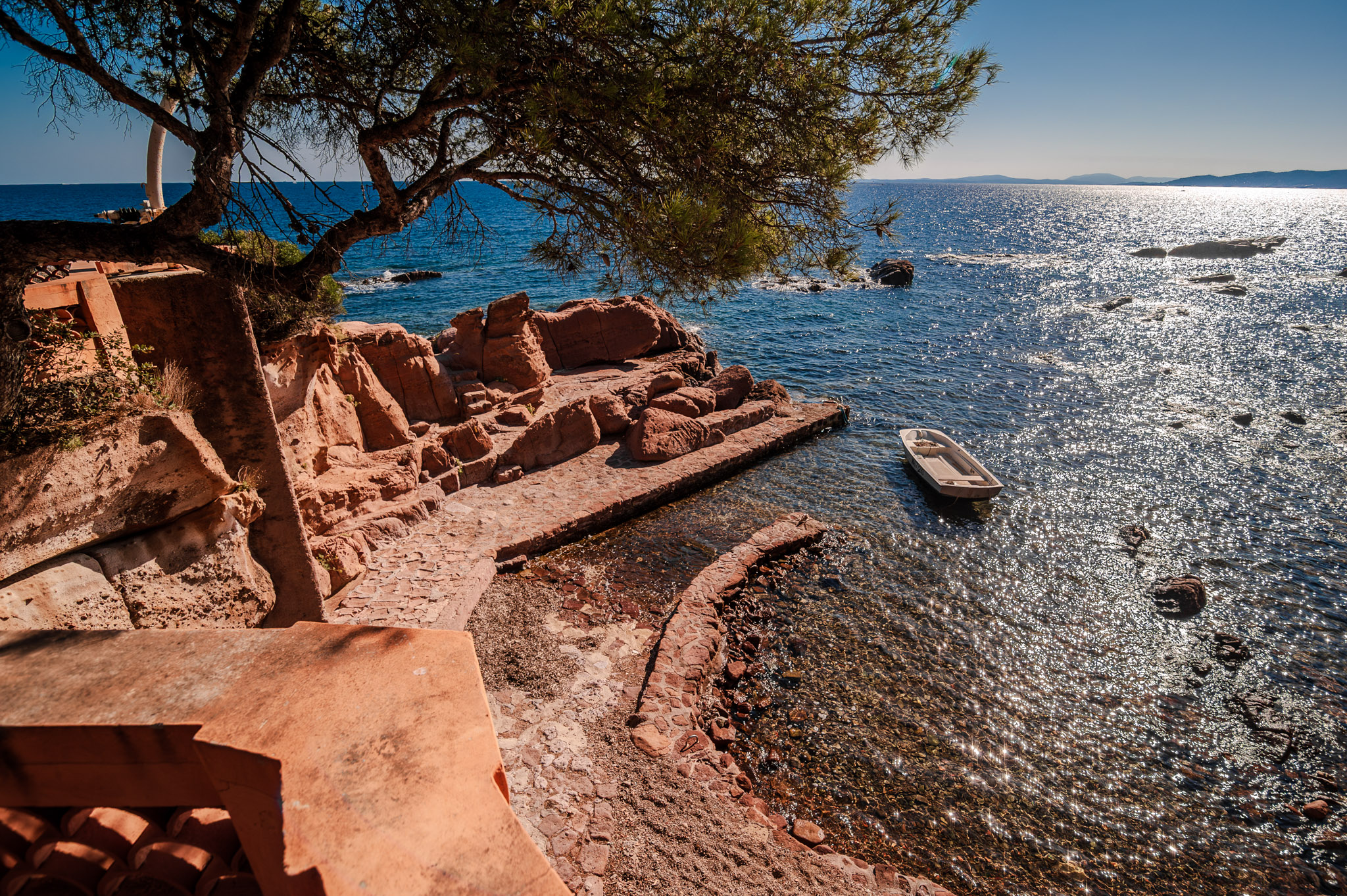 Discovering History: A shipwreck along the scenic Cote d'Azur coastline in southern France offers a stunning view for beachgoers and a glimpse into the area's rich maritime past.