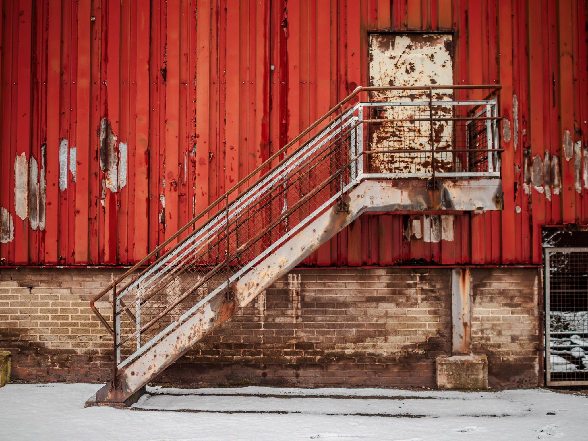 Exploring the industrial relics of the past in Saarland, Germany. This 19th century steel mill, now abandoned and rusty, tells the story of a bygone era in industrial history. Its antique brick buildings, metal equipment, and towering structures stand tall under the sunny skies, reminding us of the ingenuity and innovation of past generations. A UNESCO World Heritage Site, this factory is a famous place that still fascinates with its ancient architecture and impressive engineering. Take a step back in time and witness the past come to life in this industrial district.