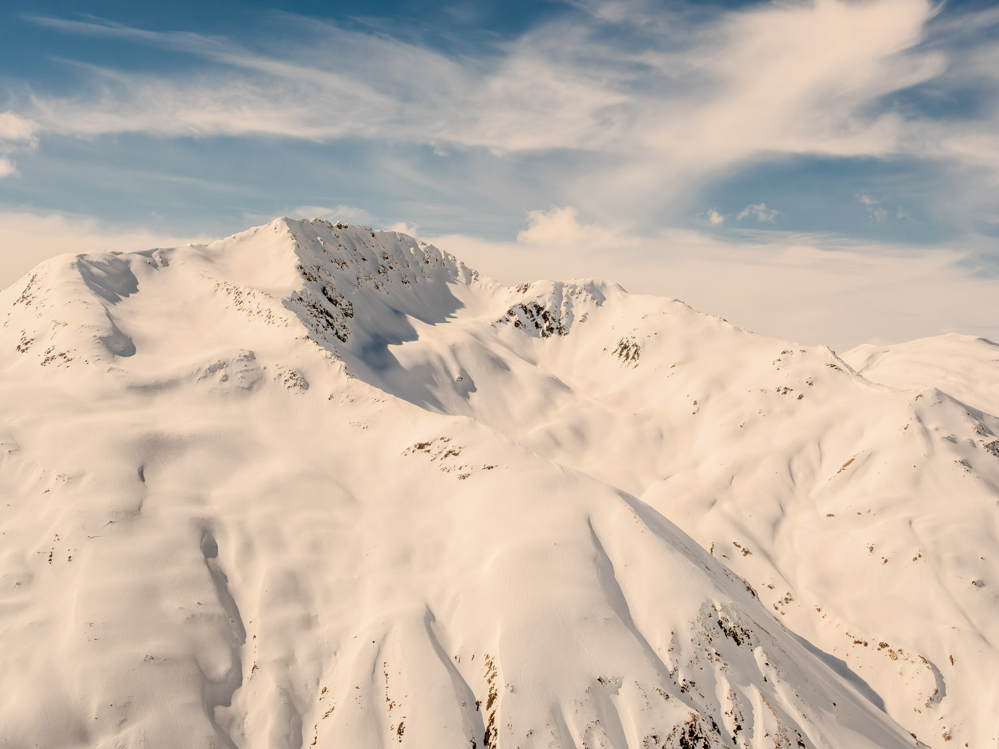 Enjoying the majestic view of the snow-capped peaks and stunning glaciers as we hike through the Alpine region of the mountain range.