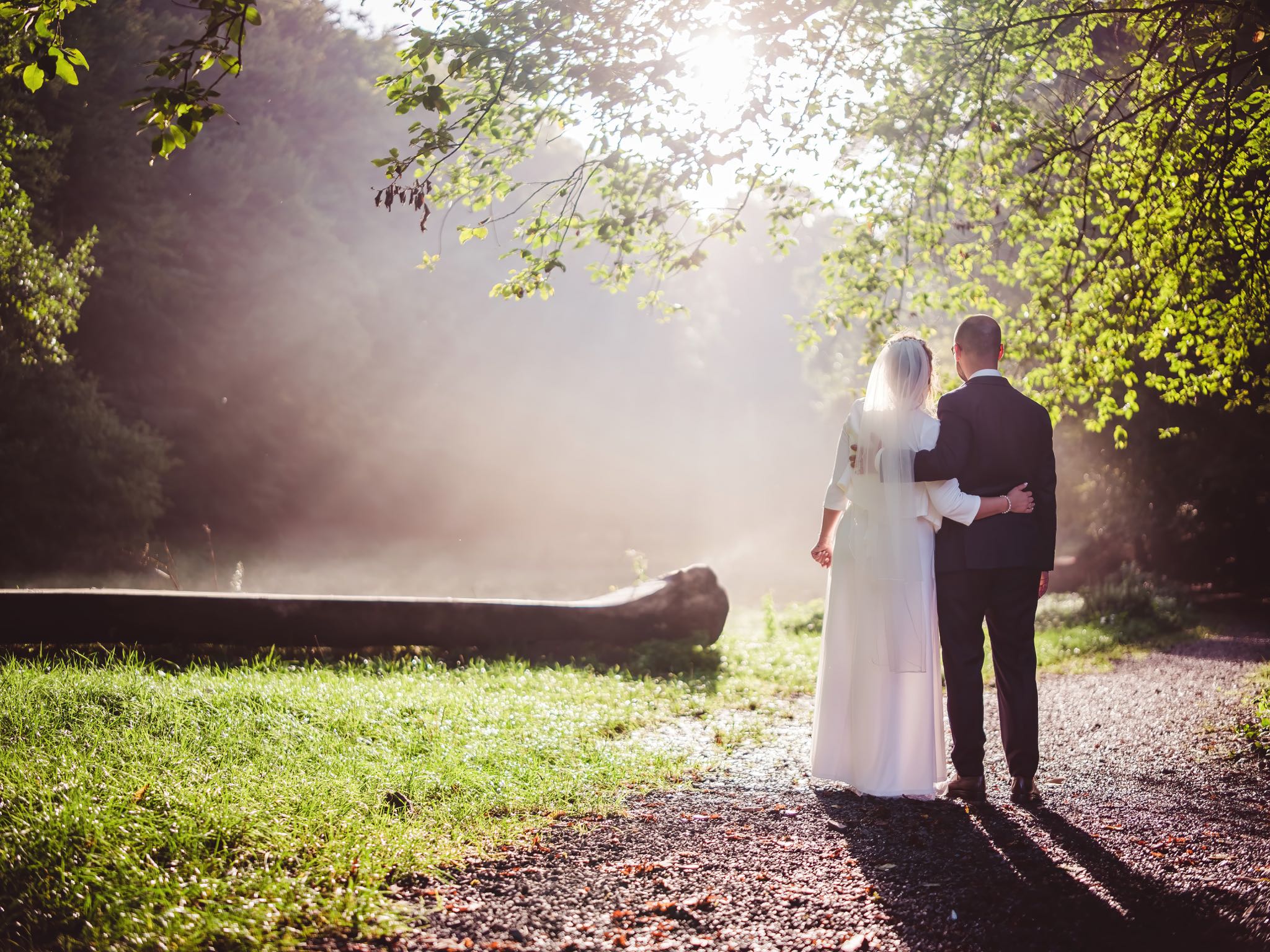 Under the summer sky in Cologne, Thomas and Nadine embrace their love, surrounded by the sweet fragrance of the grass and the joy of being married. As they smile at each other, their hearts beat as one in this idyllic outdoor setting, celebrating the beginning of their journey together as husband and wife.